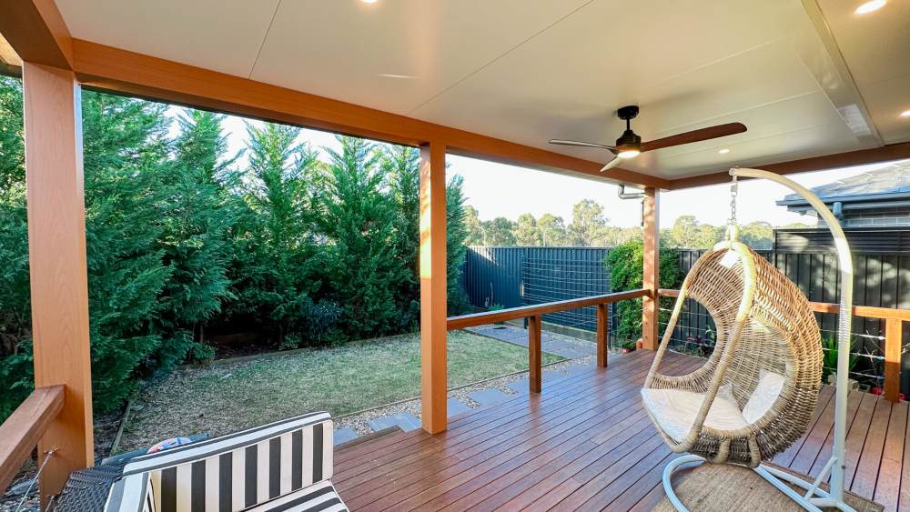 Insulated Patio Awning with Versiclad Versalink Roofing & SHS150 Timber Look Aluminium Frame & Ceiling Fan at Austral